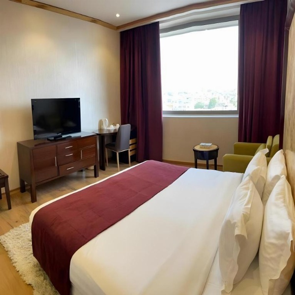 King Room with red drapes Hotel Rooms In Jeddah