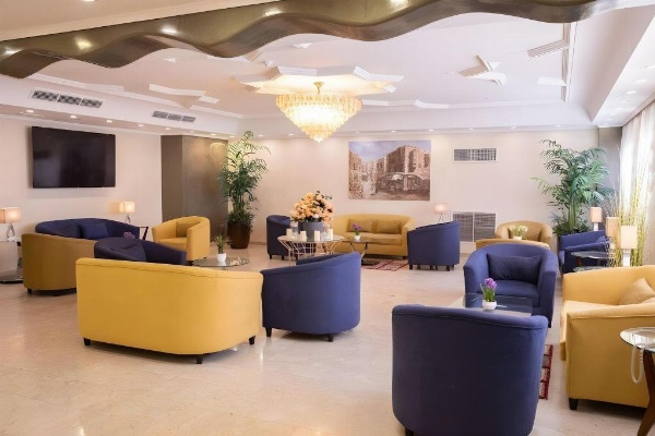 Lobby seating with blue chairs Hotel Rooms In Jeddah