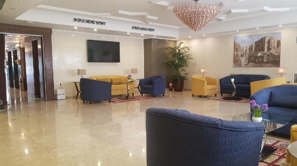 Lobby with navy sofas Jeddah Rooms